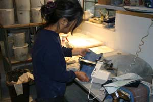 Running clay strips through the pasta machine